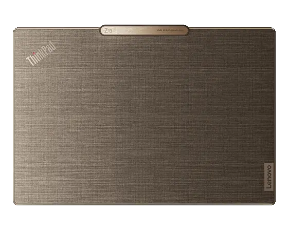 Lenovo ThinkPad Z13 Gen 2 Notebook mit bronzefarbenem Aluminiumgehäuse sowie Flachsfaser auf dem Displaydeckel, zugeklappt, Ansicht von oben.