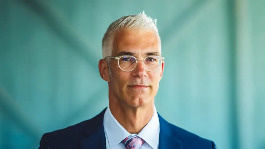 Adam Howes’s headshot.