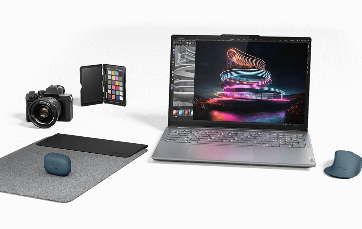 A Lenovo Yoga laptop amidst a variety of accessories and devices