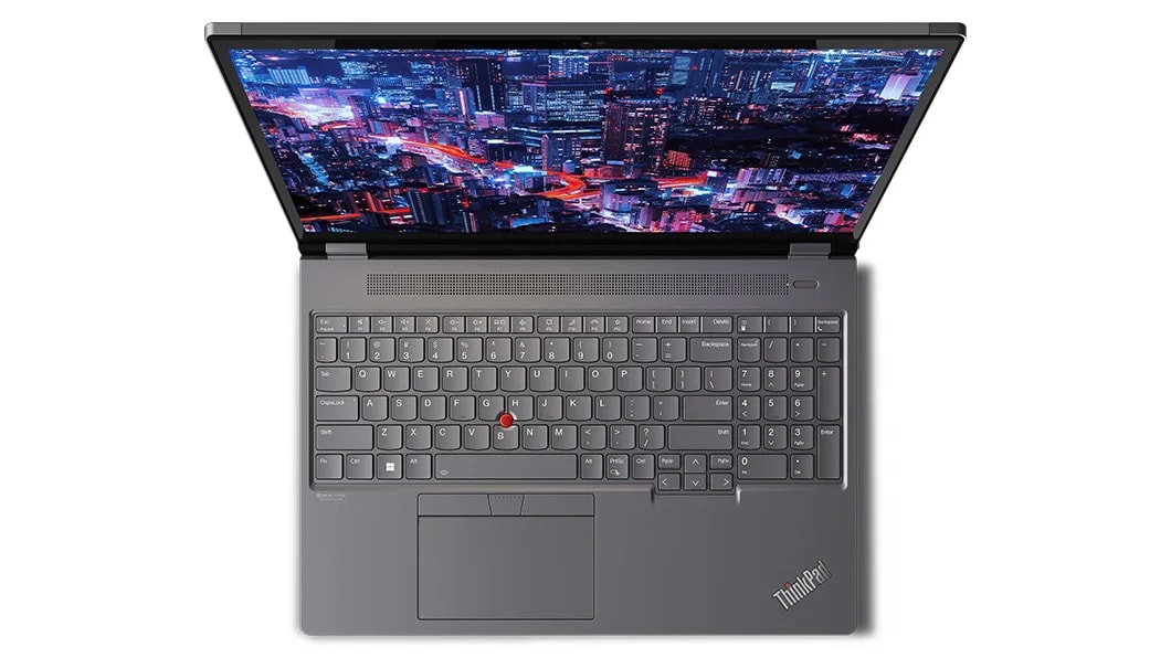 Aerial view of Lenovo ThinkPad P16 Gen 2 (16, Intel) laptop, opened, showing display with skyscrapers at night, plus keyboard
