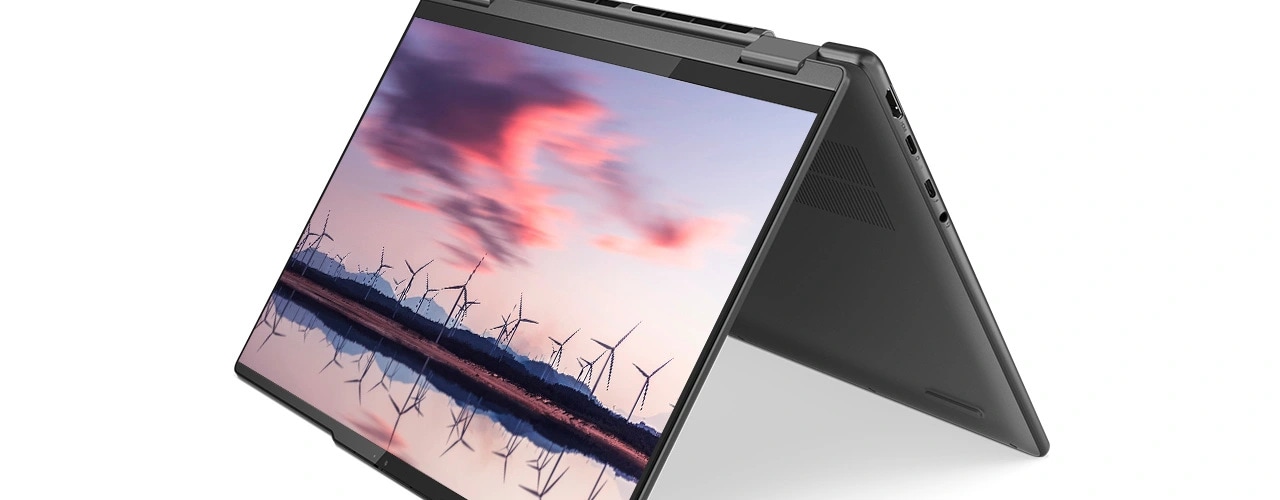 The Lenovo Yoga 7i Gen 8 (14” Intel) 2-in-1 laptop in tent mode with an image of a windmill farm reflected in water on the display