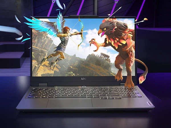 Lenovo LOQ 15IRX9 gaming laptop – front view, lid open, with game scene on the display and fighting characters seeming to pop out of the display