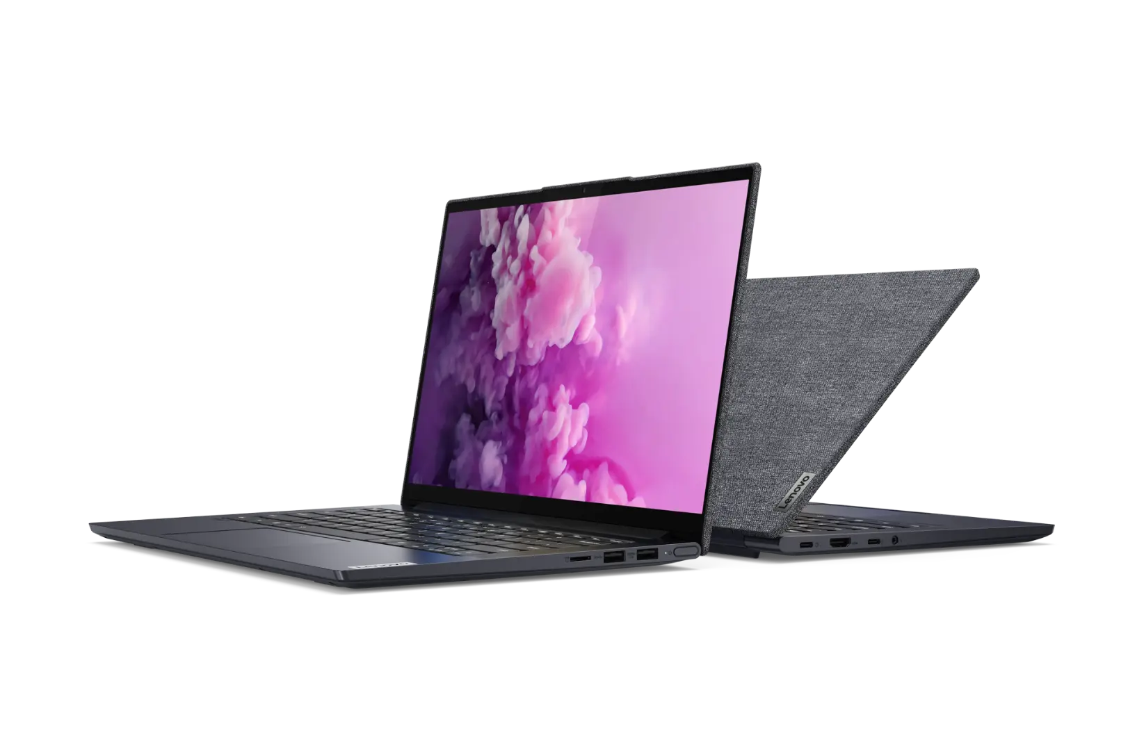 2 Lenovo Yoga Slim laptops with fabric finish sitting back to back. One with colorful pink and purple smoke image on its screen