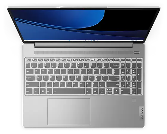 Close-up, top front view of IdeaPad Slim 5i Gen 9 15&quot; Intel laptop with lid open, showing keyboard and a blue-black graphic image displayed on the screen.