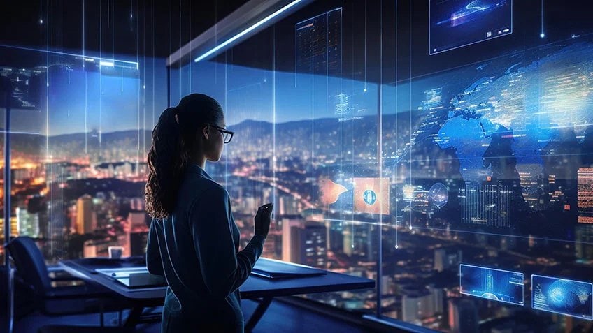 Une femme travaillant sur un écran tactile transparent futuriste.