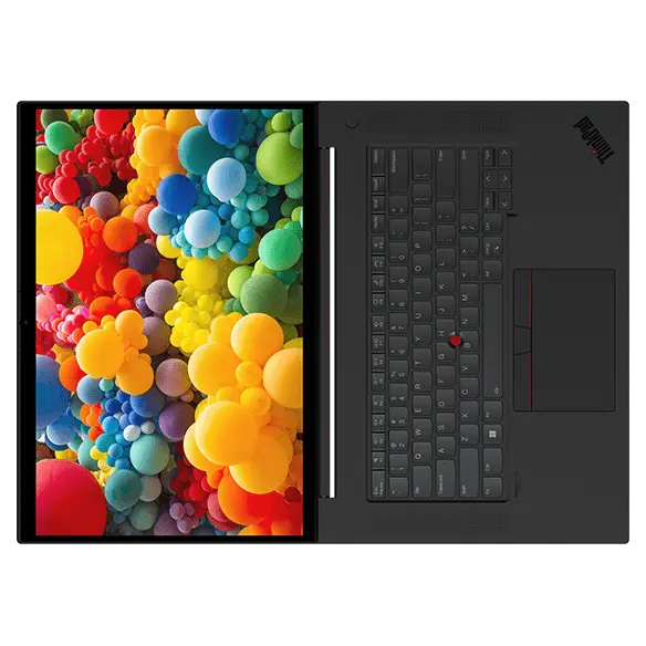 Overhead shot of Lenovo ThinkPad P1 Gen 5 mobile workstation open 180 degrees laying flat, showing keyboard and display.