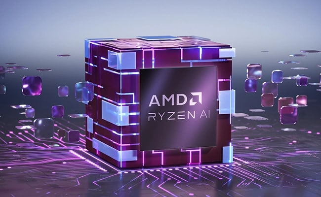 A purple and blue graphic of a cube with the text “AMD Ryzen AI” protruding from a chip in the Lenovo Yoga Pro 7 Gen 9 (14" AMD) laptop.