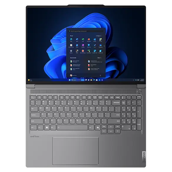 Top view of the Lenovo ThinkBook 16p Gen 5 (16” Intel) laptop when laid flat with lid opened at a wide angle & Windows 11 Pro menu displayed on the screen.