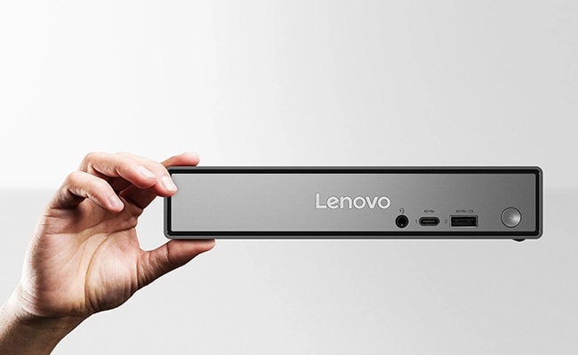 Front shot of the Lenovo ThinkCentre Neo 50q (Snapdragon) Tiny PC placed in hand, featuring a modern design in 1-litre chassis, ensuring superior performance & data security.