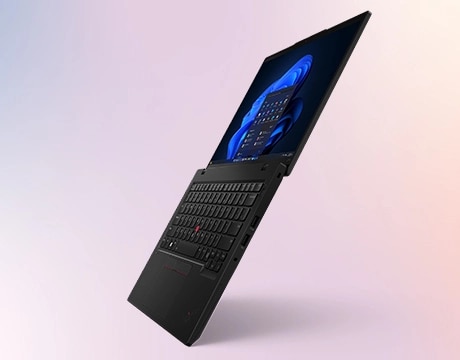 Lenovo ThinkPad L14 Gen 6 (14" Intel) laptop – right-front view, tilted back from front edge, lid open flat, with Windows 11 menu in front of Windows bloom background on the display