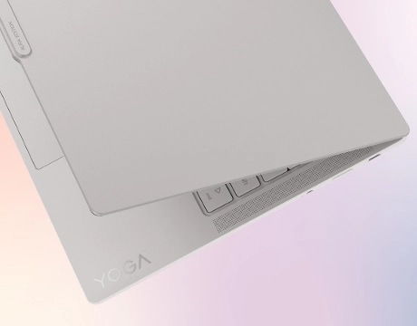 Lenovo Yoga Slim 7i Ultra Gen 11 Aura Edition 14 Closeup of the corner of a partially opened Lenovo Yoga Slim 7i Ultra Gen 11 Aura Edition (14” Intel).