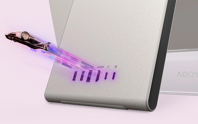 Futuristic vehicle with glowing data trails emerging from ports, showcasing the Lenovo Yoga AIO i Gen 11 Aura Edition PC.
