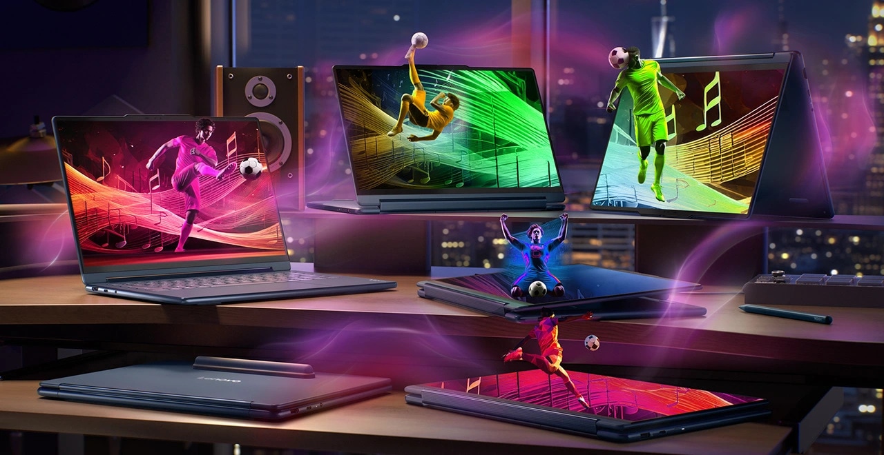 Multiple laptops displaying dynamic soccer scenes with vibrant colors, Lenovo YOGA 9i 2-in-1 Gen 11 Aura Edition.