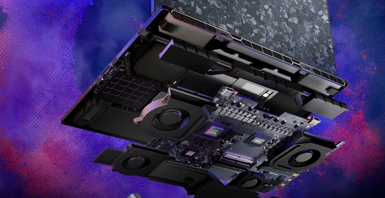 Exposed internal components of a laptop showing cooling fans and circuits, Lenovo Legion 9 Series.