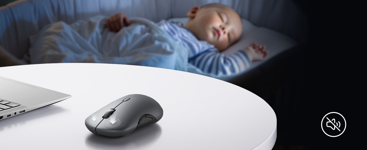 A baby peacefully sleeping on a table beside a laptop in a quiet environment with a mouse click sound nearby.