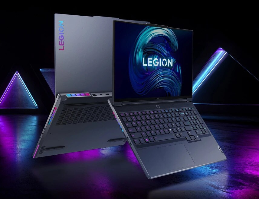 Front view of Legion 7 laptop open 135 degrees, tilted forward off its base showing keyboard, display screen and angled to show left side ports and mirrored view of back side.