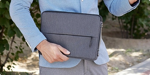 Person with Lenovo 15 inch laptop urban sleeve