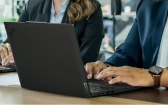 Lenovo ThinkPad T14 Gen 5 laptop, featuring a compact and durable black chassis, shown open with a vibrant display and comfortable keyboard layout.