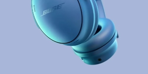 Bose QuietComfort Wireless Headphones in the color Blue Dusk are featured on a background.