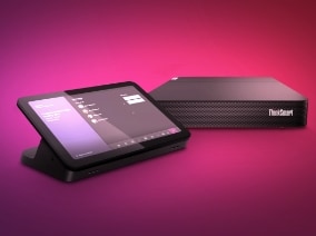 Lenovo ThinkSmart collaboration system featuring a touchscreen control panel and a compact compute module, displayed on a pink and purple gradient background.
