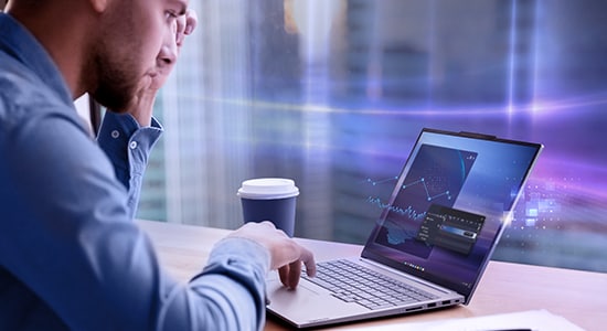 Women in a blue shirt working in an open case ThinkBook 14 Gen 6 Intel (14″).