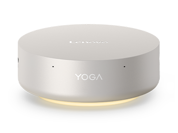 Lenovo Yoga Mini i Gen 11 PC with a glowing yellow ring around the vent, at the bottom, boasting its adaptive lighting feature.