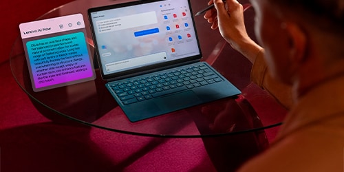 Person typing on a Lenovo tablet with a keyboard, displaying a chat interface and a message about a design proposal. The setting is sleek and modern, with subdued lighting.