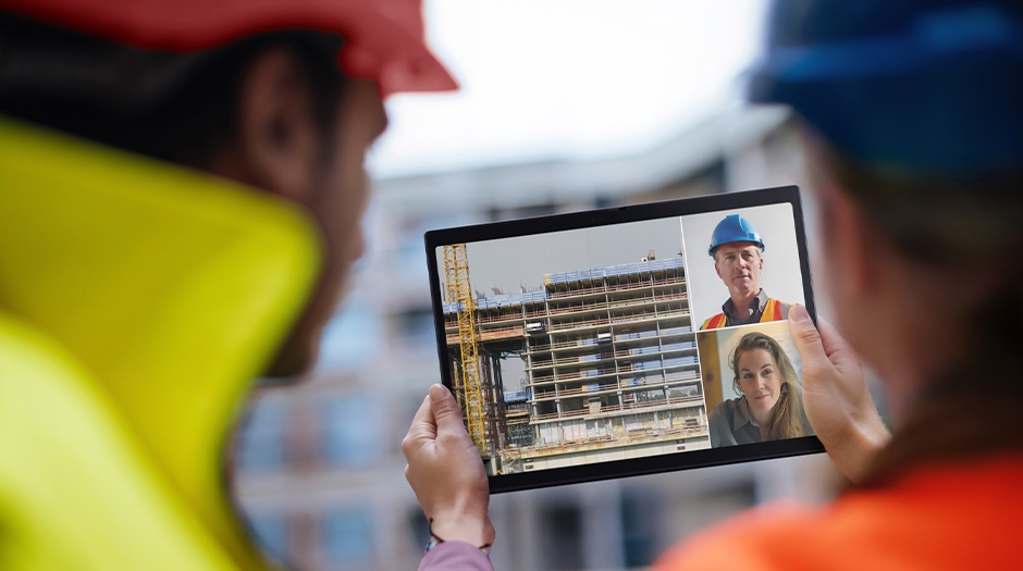 Two workers videoconference at a construction site with the Lenovo ThinkPad X13 Detachable (13” Intel).