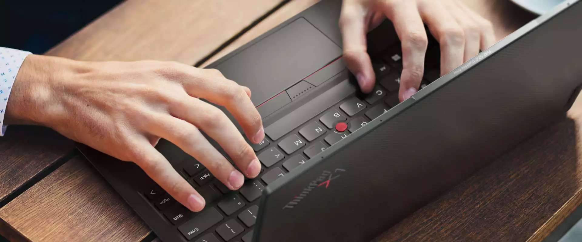 Person sitting at a desk on a videocall on the Lenovo ThinkPad X1 Yoga Gen 7 2-in-1 laptop