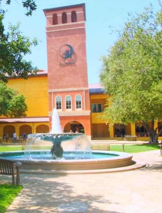 Image of DreamWorks campus featuring a fountain and lush greenery.