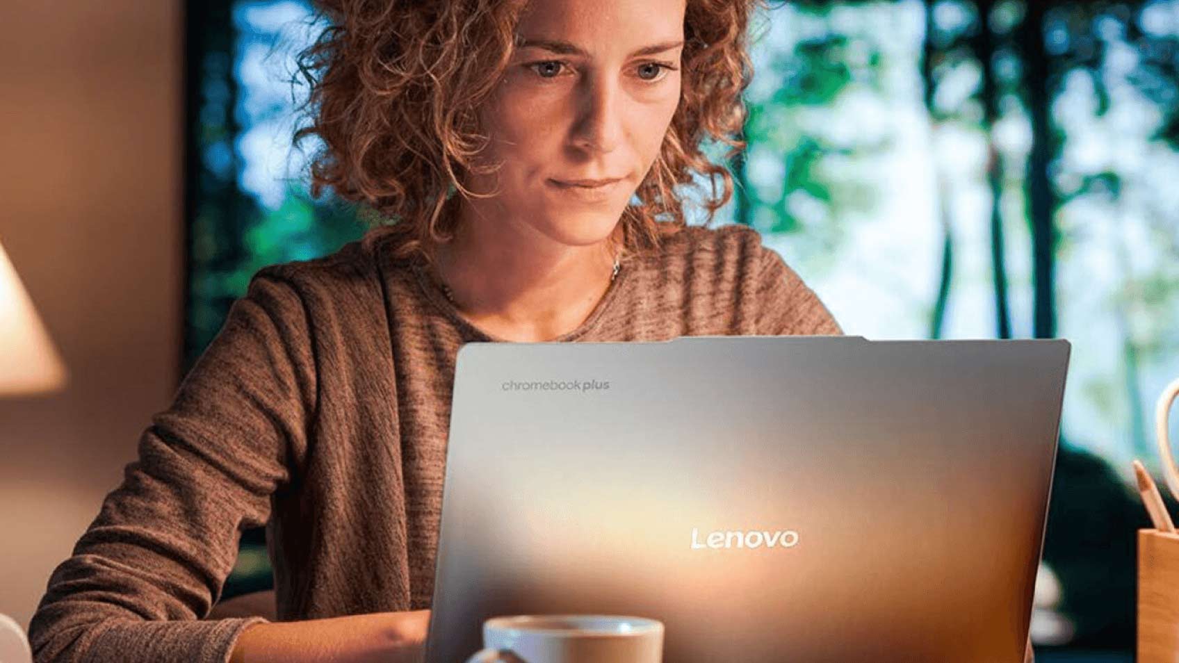 A focused woman using a laptop.