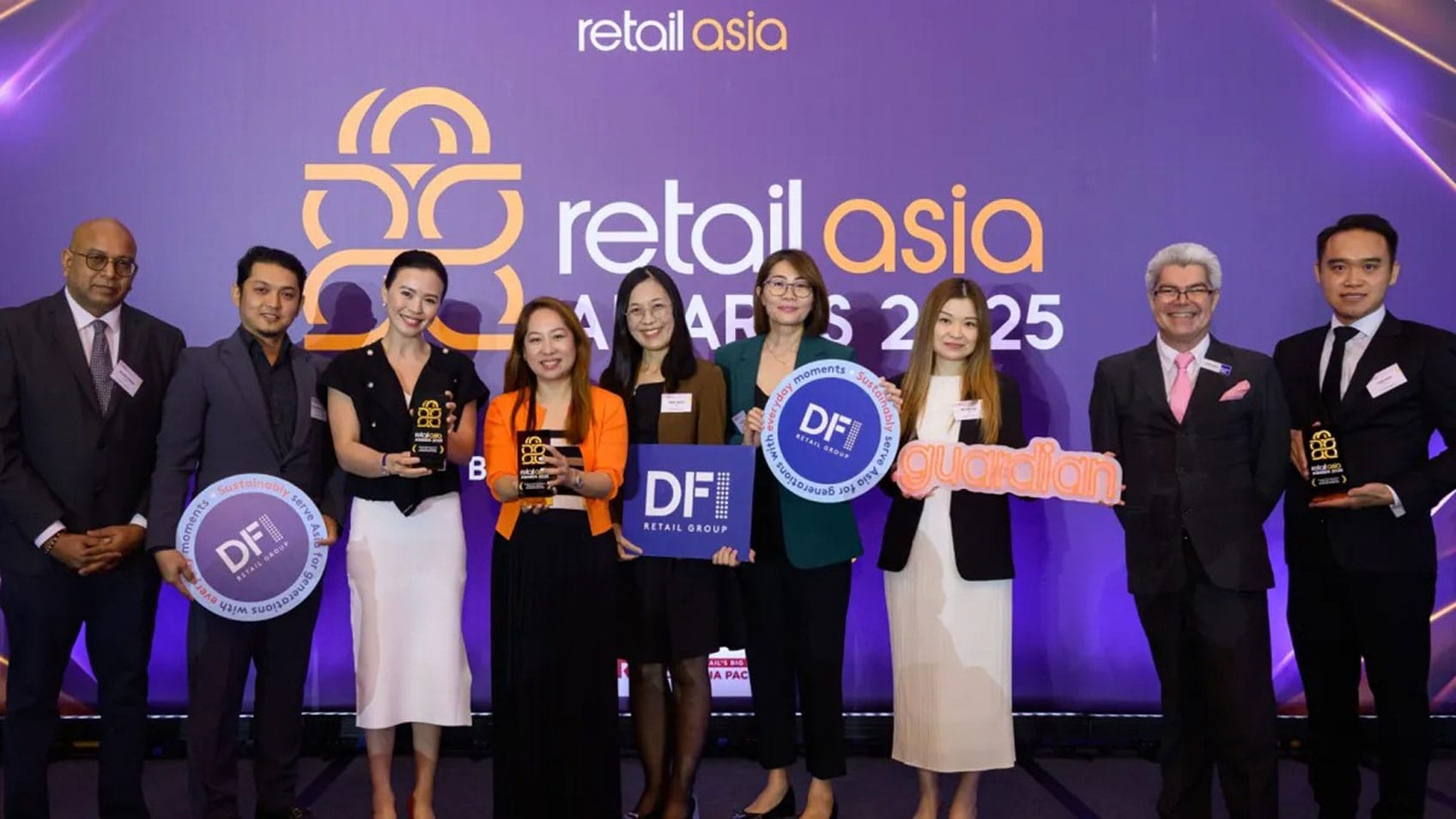 DFI Retail Group employees accepting the Supply Chain Innovation of the Year Award at Retail Asia 2025. 