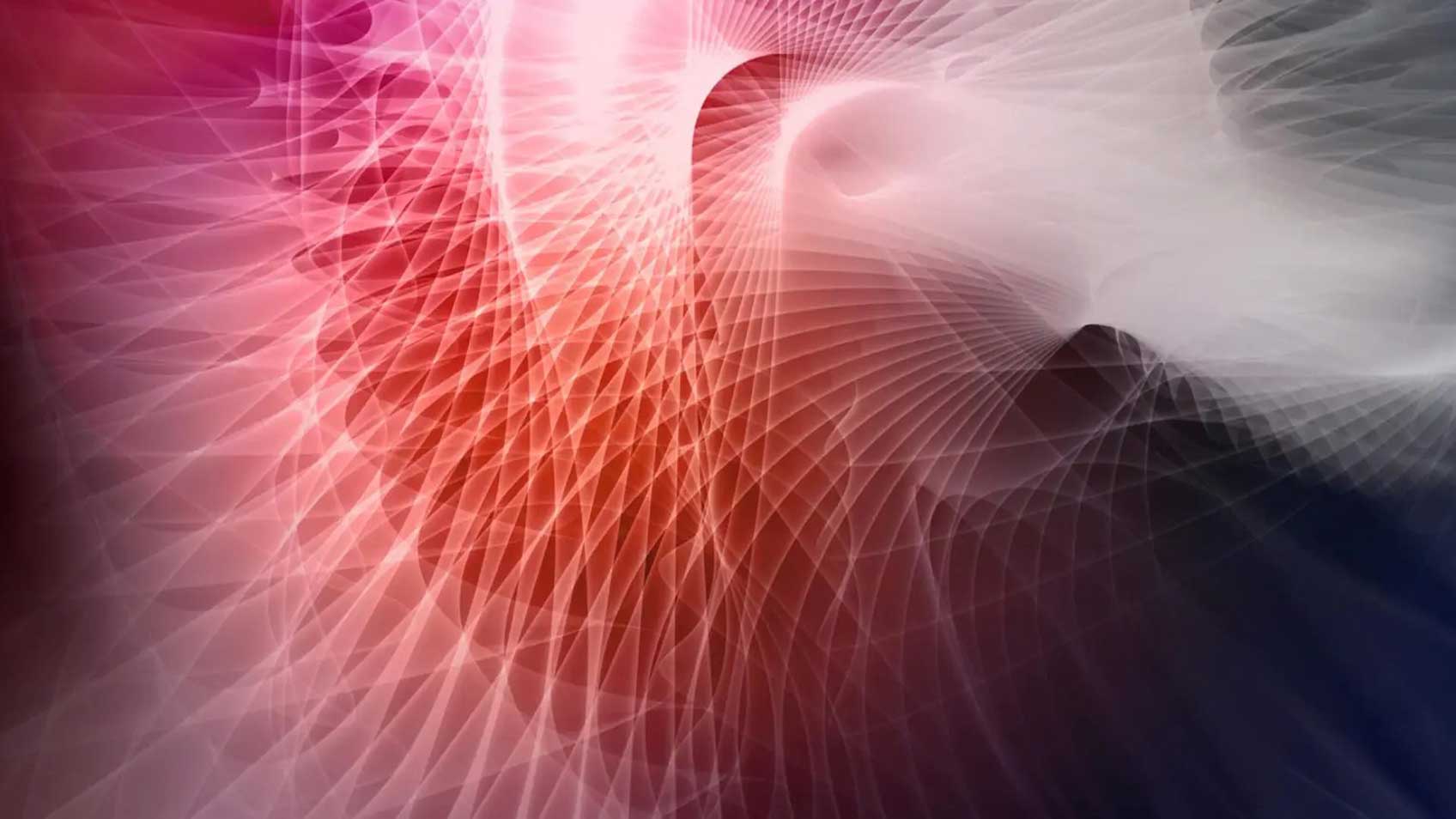 An abstract image of a spiraling red light. 