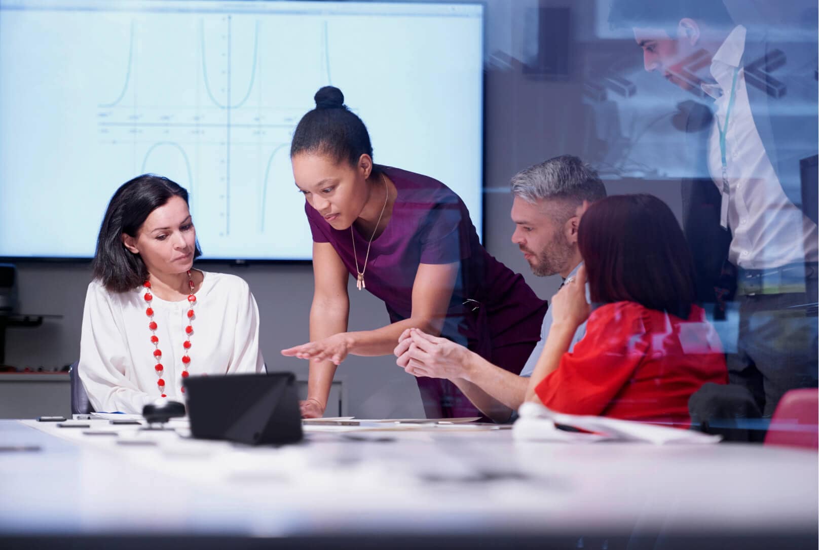 A group of colleagues collaborating in a conference room