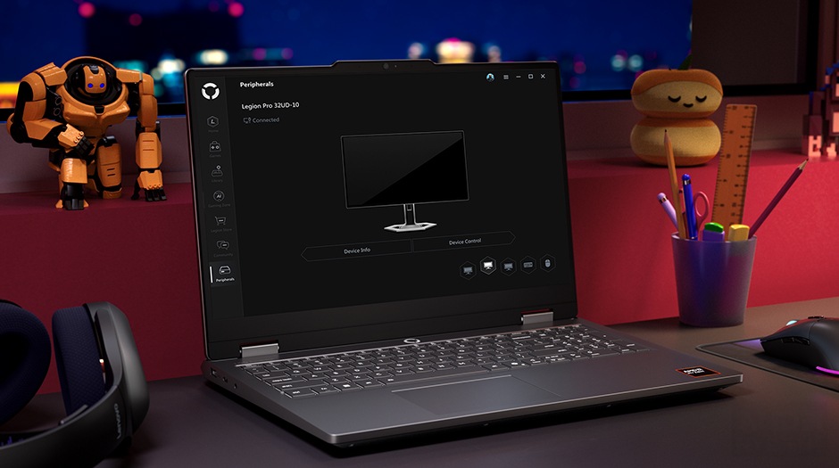 A Lenovo LOQ 15AHP10 on a desk with the Legion Space Device Management UI on the screen.