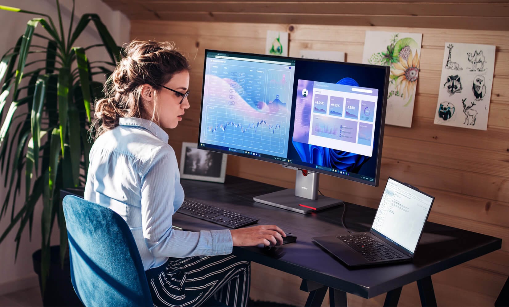 ThinkVision P40wd-40 dual-monitor setup for office, displaying data charts and interfaces, enabling efficient multitasking and productivity.