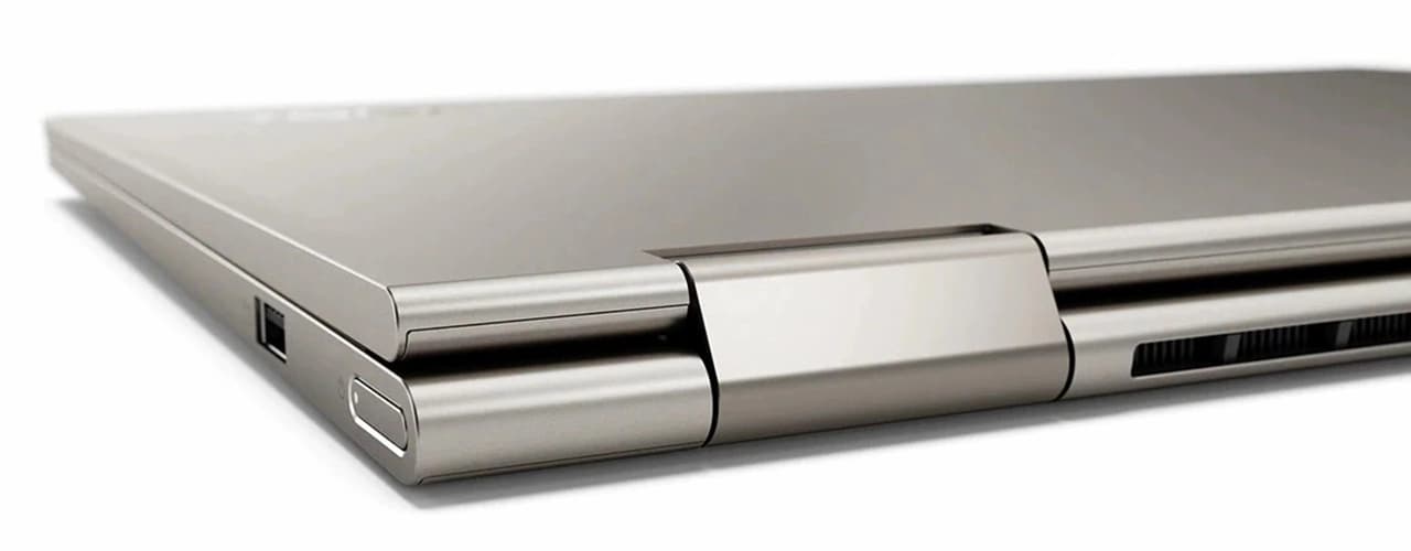 An Iron Grey Yoga C740 closed at an angle, with a close-up of the hinge
