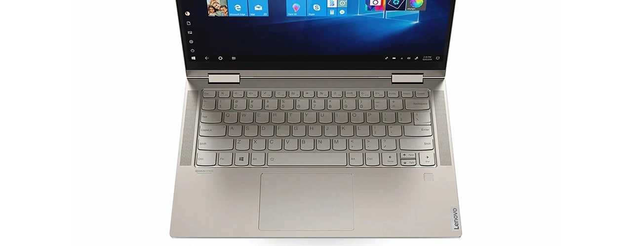An Iron Grey Yoga C740 from above, showing the keyboard and front-facing speakers with Dolby Atmos®