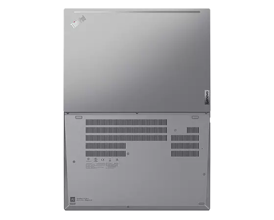 Aerial view of ThinkPad T16 Gen 1 (16” AMD) laptop, opened 180 degrees, laid flat, showing front and rear cover