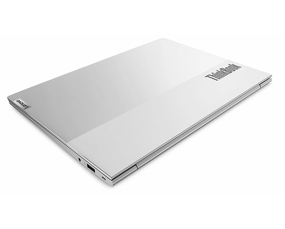 A dual-tone ThinkBook 13s Gen 4 (Intel) laptop viewed from the right-rear at a 30° angle with its top over closed, highlighting the distinctive ThinkBook logo and right-side ports.