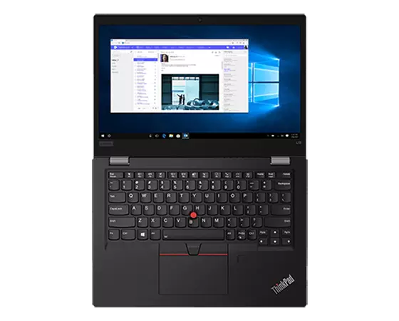 Top view of the ThinkPad L13 Gen 2 (13'' AMD) laptop laying flat, showing the keyboard, trackpad, and display, which shows a Windows background