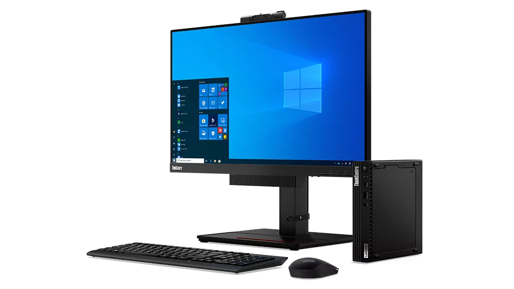 Lenovo ThinkCentre M75q Gen 2 placed next to to monitor, keyboard and mouse
