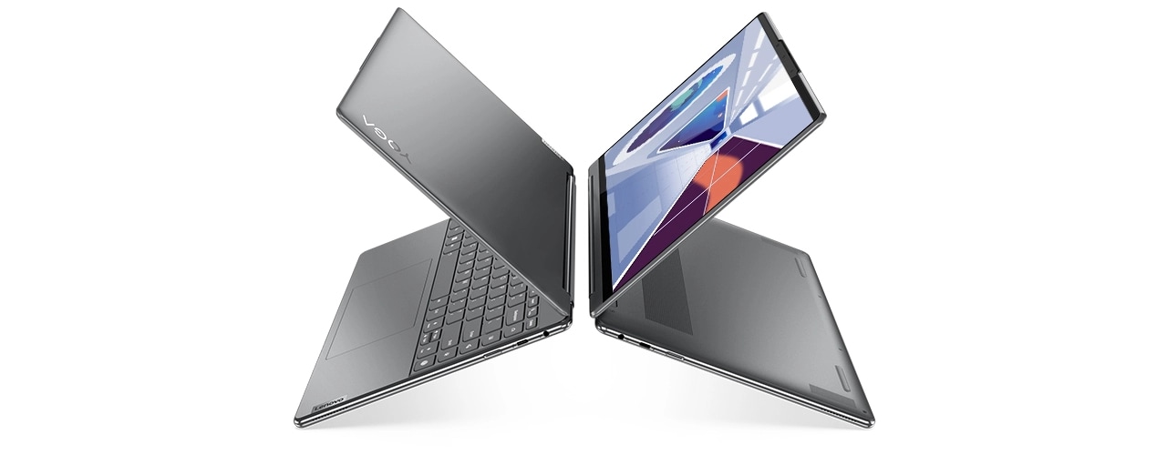 Two Yoga 9i Gen 8 2-in-1 laptops, Oatmeal color, back-to-back, opened in laptop mode at angle, creating the letter X
